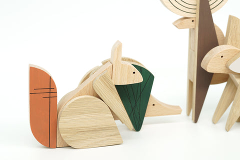 Wooden forest animals on a white background
