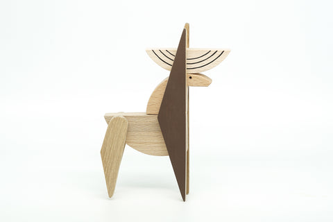 Wooden deer-shaped object on a white background