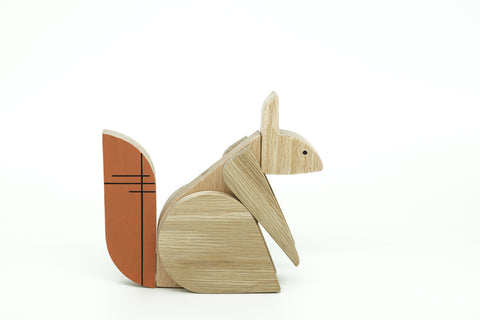 Wooden squirrel figurine on a white background