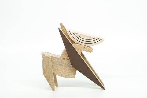 Wooden deer toy on a white background