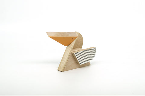 MInimalist pelican figurine, geometric design on a white background