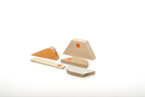 Set of wooden blocks with orange magnets on a white background