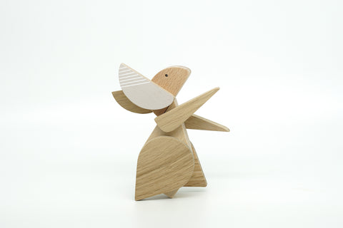 Wooden rabbit figurine on a white background