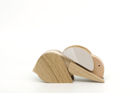 Wooden rabbit figurine on a white background